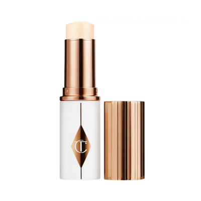 Тональная основа в стике Charlotte Tilbury Unreal Skin Sheer Glow Tint (1.5 Fair) 9 g